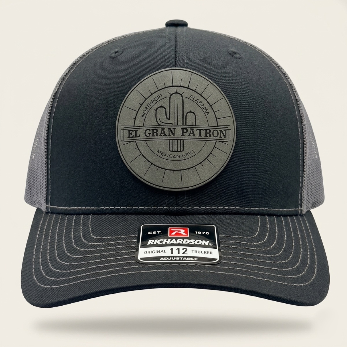 Black Richardson trucker cap with engraved El Gran Patron Mexican Grill cactus logo patch