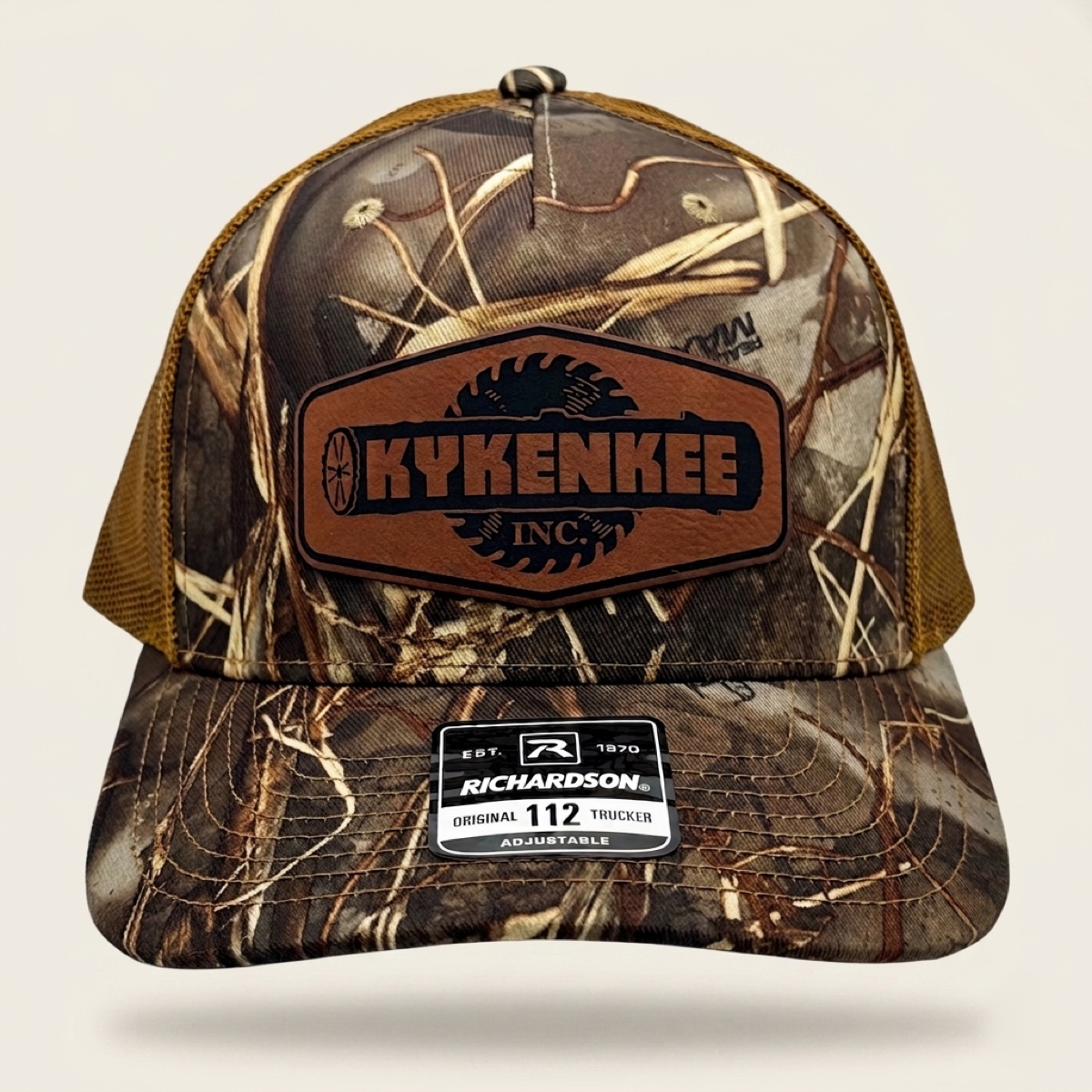 Kykenkee Realtree Max-7 camo Richardson trucker cap with engraved rawhide leatherette logo patch